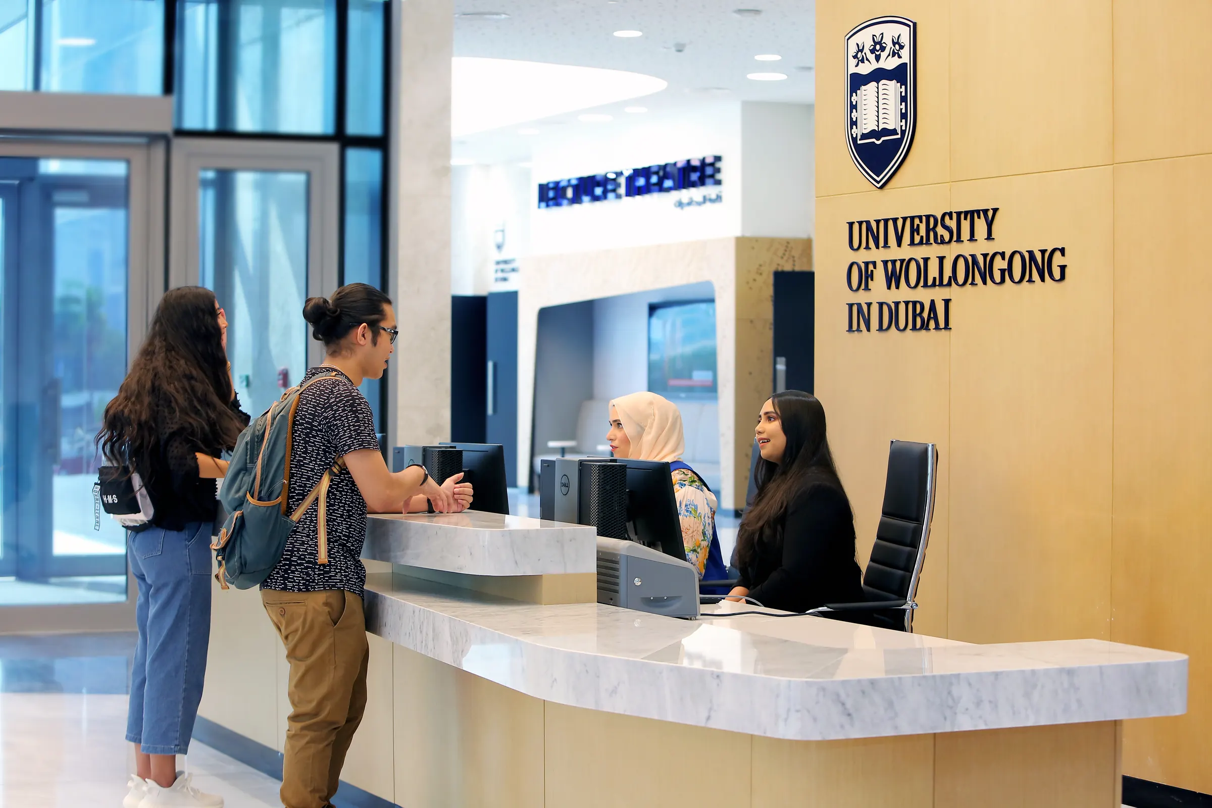 Students at a university admissions reception desk